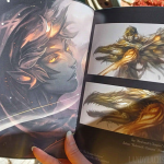 Photograph showing one of the interior spreads from the booklet. This is from the booklet's "extra artwork" section.