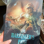 Photograph of the cover for "The Harbinger's Path" Trahaerne & Malyck fan comic.